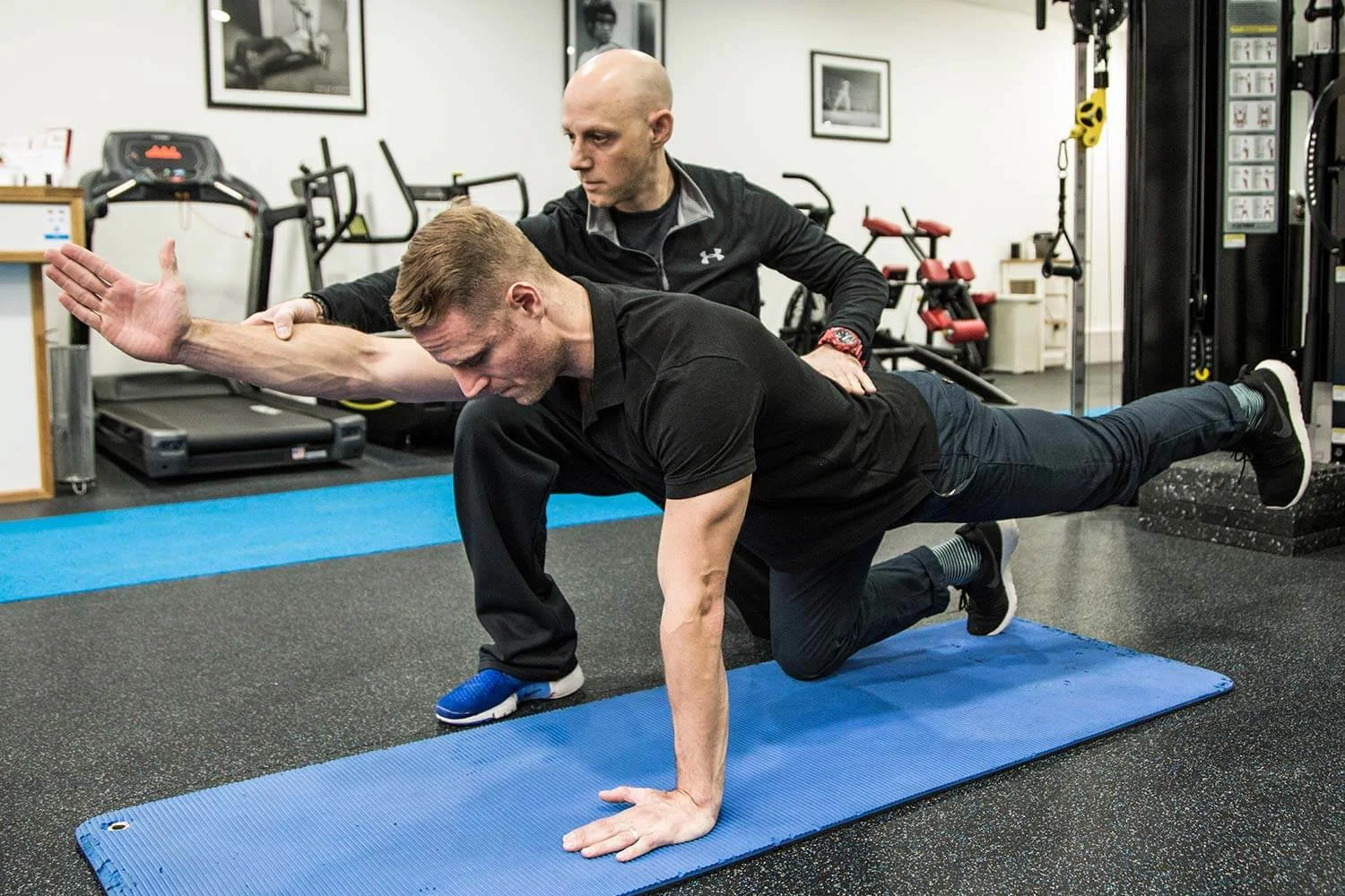 Joel Proskewitz coaching a patient through a spinal stability exercise